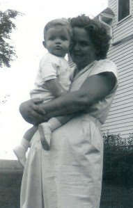 #144=Elliott in Mom's arms; circa September 1954